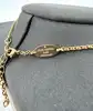 collier louis vuitton essential v en laiton à finition dorée