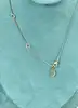 collier michal negrin fleurs pendantes