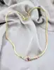 collier or centré un motif en 2 ors orné d'un rubis et de petits diamants or 750 millième (18 ct) 13,21g