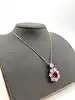 collier pendantif pierre rouge et oxydes