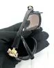 lunettes de soleil chanel 5127-b camélia strass monture noire et verres marron