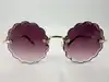 lunettes de soleil chloé rosie ce142s monture dorée et verres violet dégradé