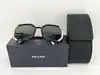 lunettes de soleil prada spr20x avec des verres noirs