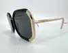lunettes de soleil prada spr20x avec des verres noirs
