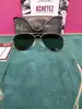 lunettes de soleil ray ban aviator rb 3025 avec les verres vert et la monture et les branches en métal doré