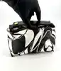 mini sac à main vintage emilio pucci en soie noir et blanc