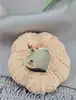 pendentif coeur "maman d'amour" or 750 millième (18 ct) 1,24g