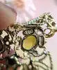 pendentif filigrane serti de 4 péridots ovales or 750 millième (18 ct) 4,35g