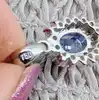 pendentif maguerite en or blanc centré d'un beau saphir entouré de 2 rangs de diamants or 750 millième (18 ct) 2,31g
