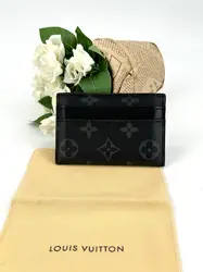 porte-cartes double louis vuitton en toile monogram éclipse et cuir noir