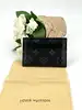 porte-cartes double louis vuitton en toile monogram éclipse et cuir noir