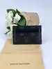 porte-cartes double louis vuitton en toile monogram éclipse et cuir noir