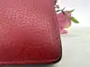 portefeuille louis vuitton multiple pour homme en cuir rouge