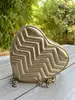 sac à main maje coeur en cuir métalisé doré
