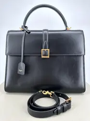 sac à main saint laurent le fermoir top handle en cuir lisse noir avec bandoulière ajustable et amovible