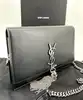 sac bandoulière yves saint laurent kate en cuir lisse noir avec pompon et finitions argentées