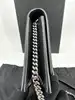 sac bandoulière yves saint laurent kate en cuir lisse noir avec pompon et finitions argentées