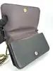 sac pochette coach en cuir grainé noir, chîne dorée détachable
