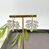sibo025 boucles d'oreilles pendantes avec pierre de lune motif feuille
