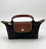 trousse cosmétique avec poignée longchamp le pliage original en toile noire