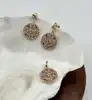 23090405 boucles d'oreilles ronds motif fleur orné d'oxydes