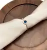 2966460 bague solitaire perlée avec oxydes bleu rond et incolores t54
