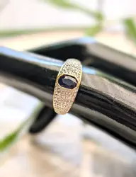 bague bombée en 2 ors centrée d'un saphir or 750 millième (18 ct) 2,61g