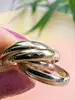 bague cartier trinity vintage collection les must de cartier ornée de 5 anneaux entrelacés or 750 millième (18 ct) 7,41g