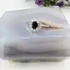 bague marguerite centrée d'une pierre bleue entourée d'oxydes t54 argent autre 3,03g