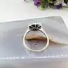 bague marguerite centrée d'une pierre bleue entourée d'oxydes t54 argent autre 3,03g
