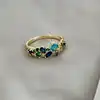 bague ornée d'oxydes bleus en métal doré