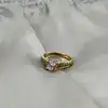 bauge solitaire ornée d'oxydes en métal doré