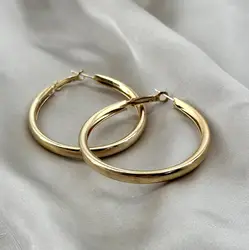boucles d'oreilles créoles en acier doré