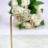 boucles d'oreilles créoles ornées d'oxydes en acier doré