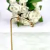 boucles d'oreilles créoles ornées d'oxydes en acier doré