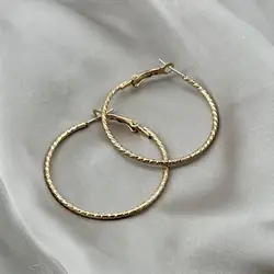 boucles d'oreilles créoles texturées en acier doré