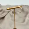 boucles d'oreilles créoles torsadées en acier doré