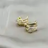 boucles d'oreilles demi-créoles ornées d'oxydes en acier doré