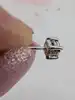 boucles d'oreilles puces en or blanc chacune sertie d'un petit diamant d'environ 0,03ct or 750 millième (18 ct) 1,27g