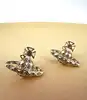 boucles d'oreilles vivienne westwood modèle harlequin orb doré et blanc