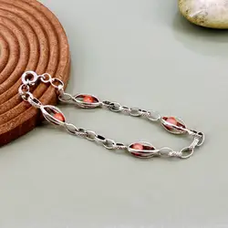 bracelet en argent orné de perles roses logées dans des maillons ajourés argent autre 6,63g