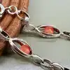 bracelet en argent orné de perles roses logées dans des maillons ajourés argent autre 6,63g
