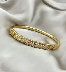 bracelet jonc orné d'oxydes en métal doré