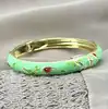 bracelet joncs en émail vert à motif floral