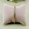 bracelet maille goumette en métal doré