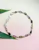 bracelet rivière serti des pierres de couleur or 750 millième (18 ct) 4,88g