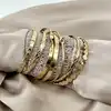 bracelet semainier 7 joncs ouverts en acier doré