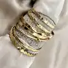 bracelet semainier 7 joncs ouverts en acier doré