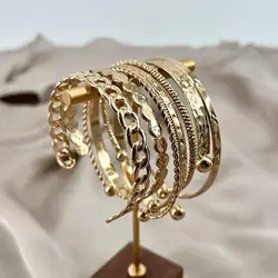bracelet semainier 7 joncs ouverts en acier doré