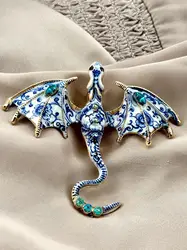broche dragon en émail bleu et métal doré